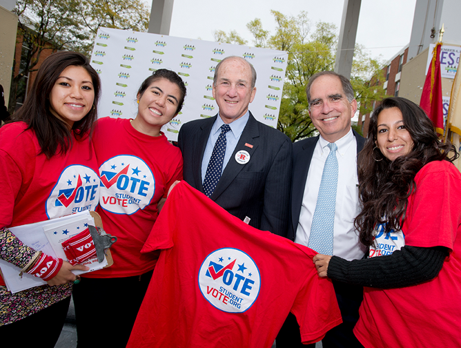 President Barchi and Pete McDonough with three students at the bond rally